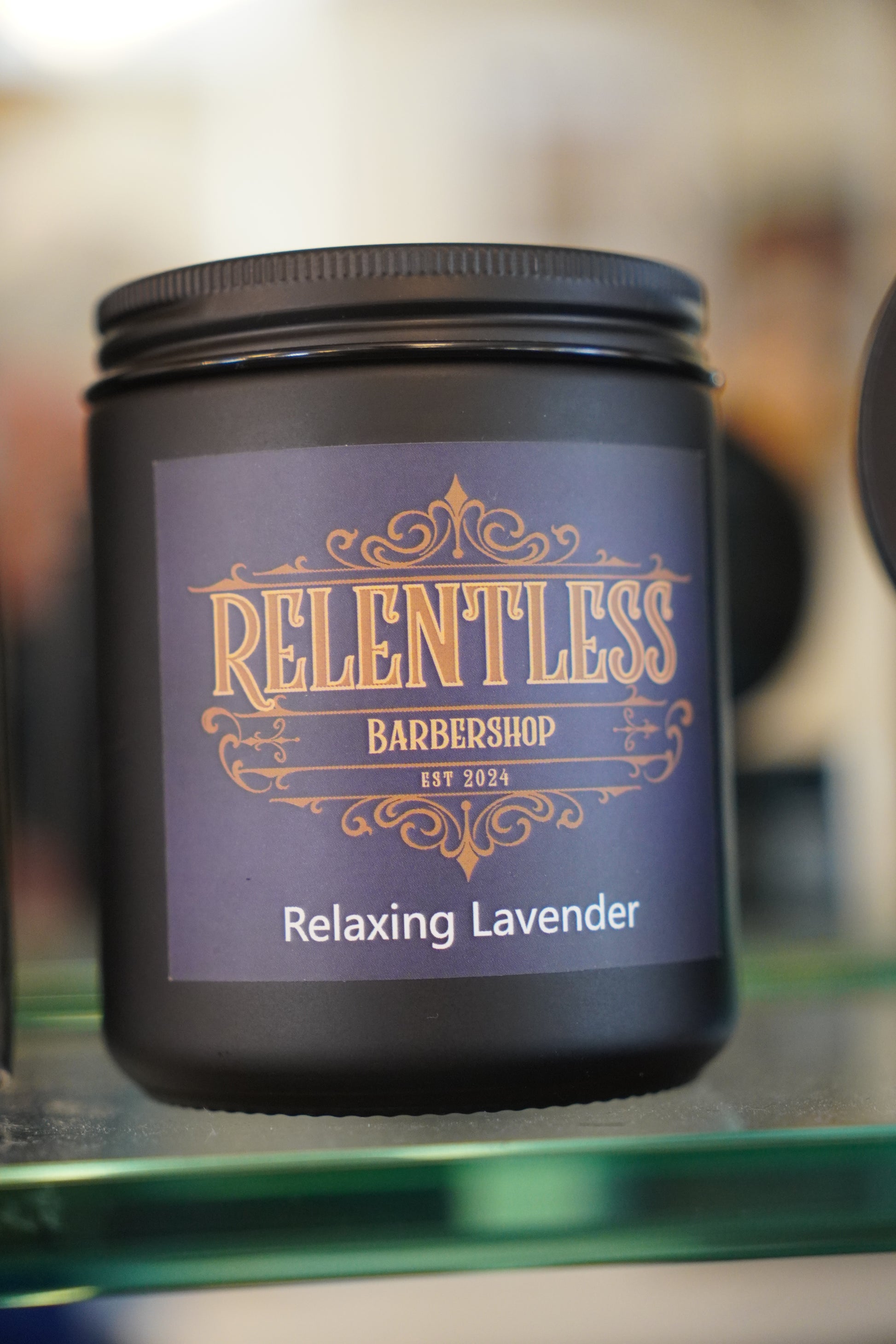 Jar of Relentless Barbershop Relaxing Lavender on a blurred background