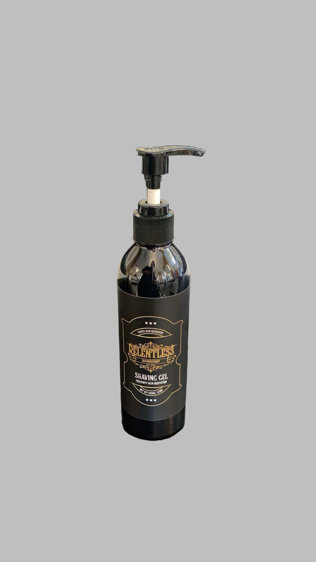 Black bottle with pump on a dark surface