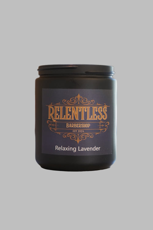 Candle labeled 'Relentless' with 'Relaxing Lavender' on a blurred background